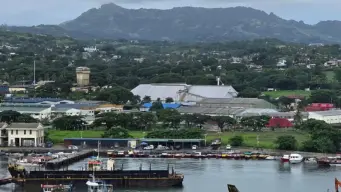 Lautoka port city in Fiji with cargo ships, sugar factory and tropical coastline