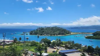 Savusavu Bay in Fiji with turquoise water, tropical hills, and peaceful eco-resorts